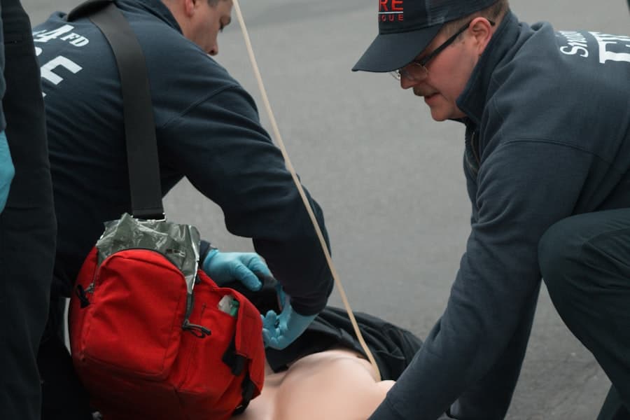 Two responders practising resuscitation on a training manikin